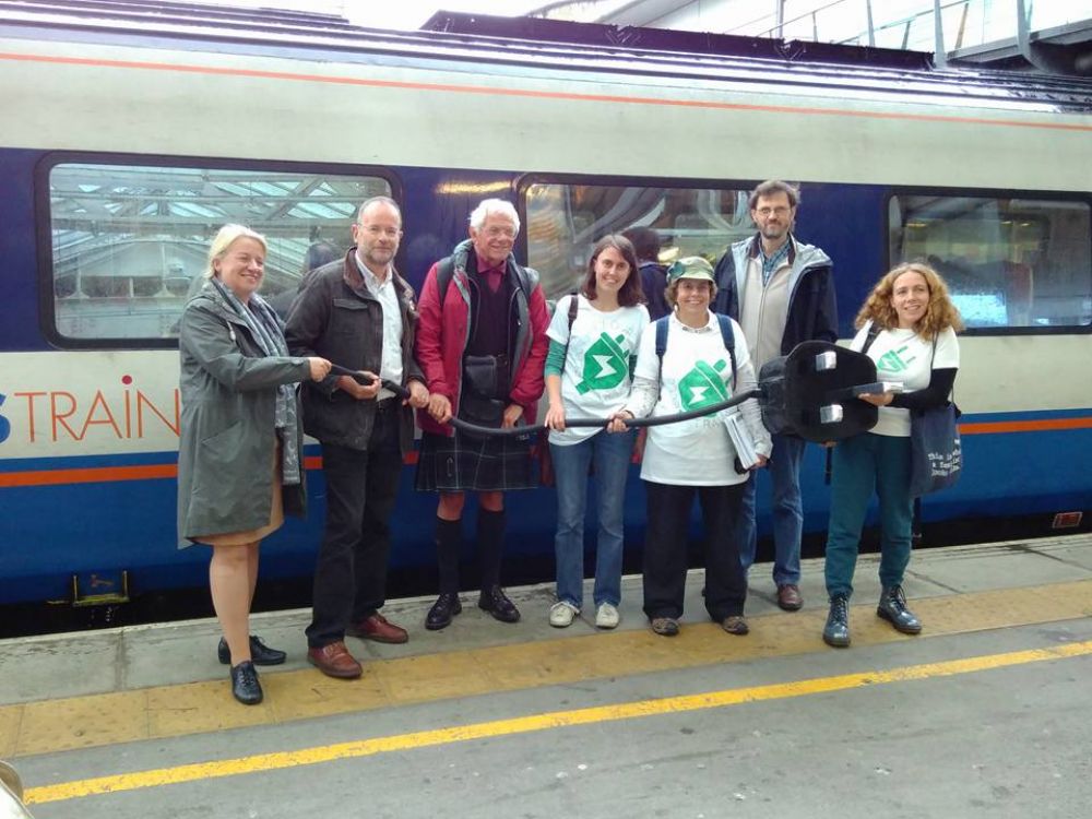 Leicester Friends of the Earth carried a giant plug around Midlands railway stations