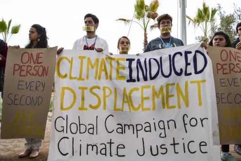 photo of protest against climate induced migration at COP22