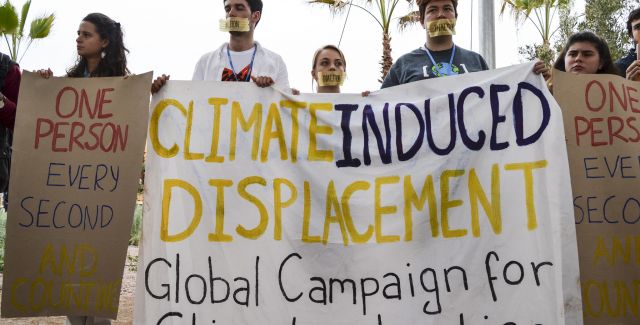 photo of protest against climate induced migration at COP22