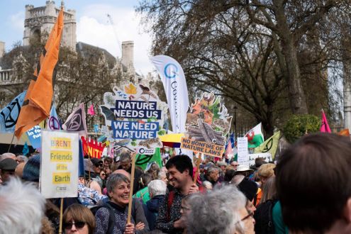 A group of campaigners with signs to protect nature