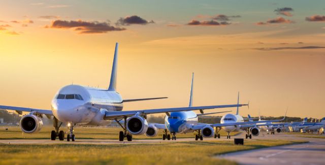 Airplanes on a runway waiting to take off