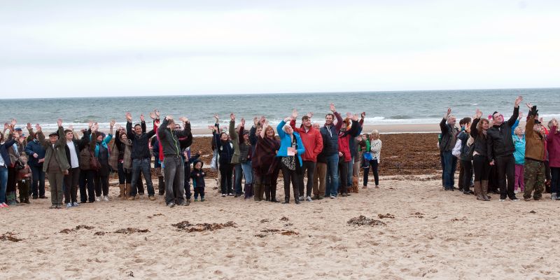 A local group on a sandy beach
