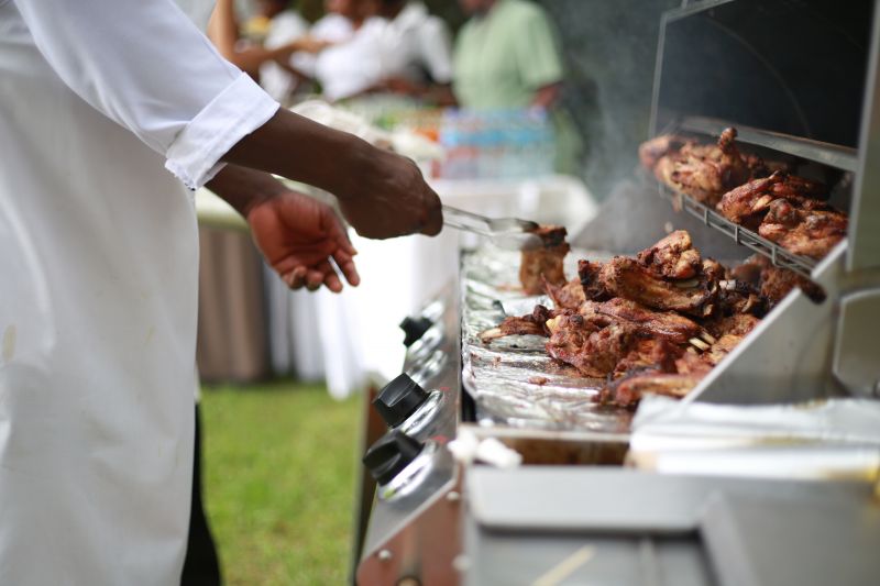 Catering barbecue showing hands of chef