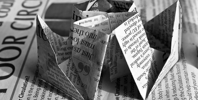 Waste newspaper folded into the shape of a boat