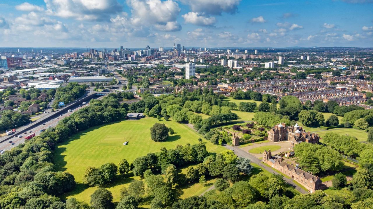 A park with trees and grass on the edge of Birmingham city centre