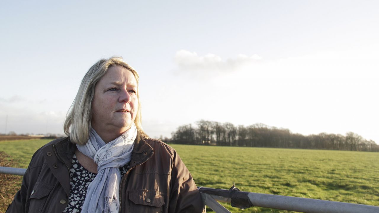 Barbara standing by the proposed fracking site (Roseacre wood), which is behind her.