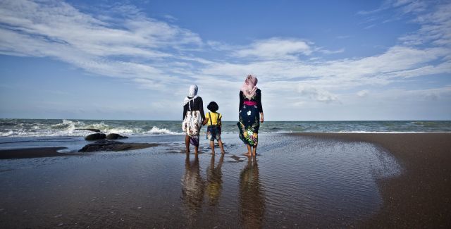 Visitors enjoying the view at Tanjung Pesona beach in Tanjung Pesona, District Sungai Liat, Bangka, Indonesia