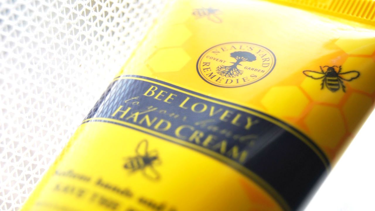 A close-up of a tube of bee lovely hand cream by Neal's Yard Remedies