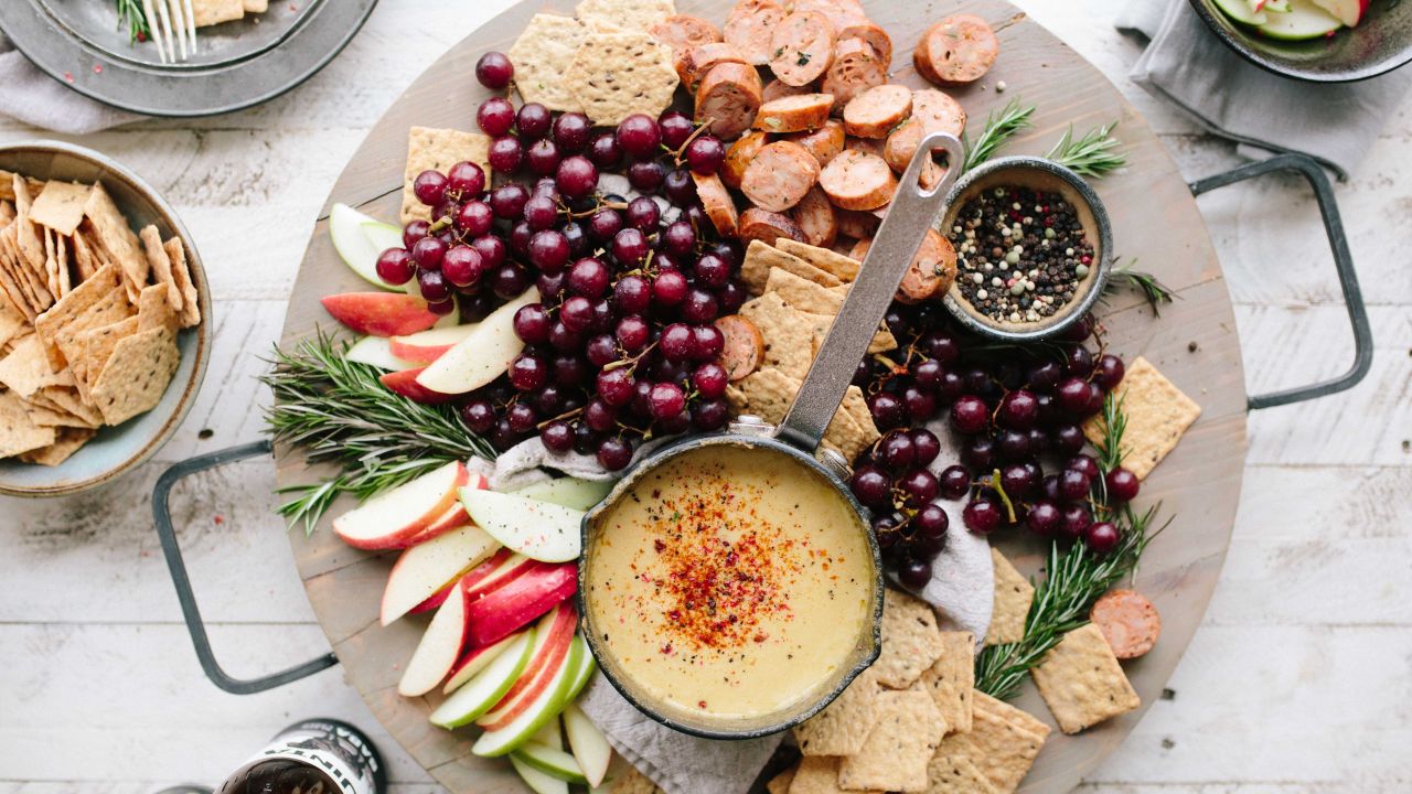 Platter of fruit, crackers and cheese.