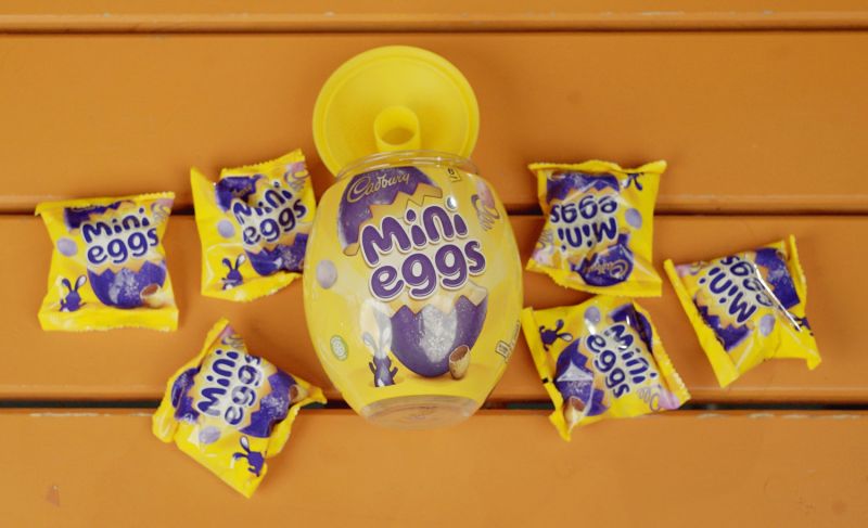 Packets of Cadbury mini eggs, emptied out of plastic egg container