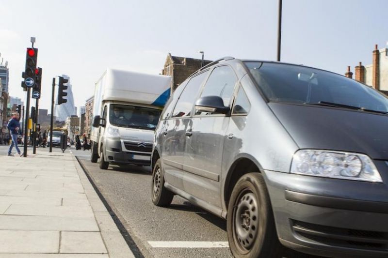 Car and van stuck in traffic