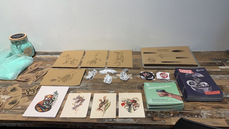 Table with tattoo designs on card