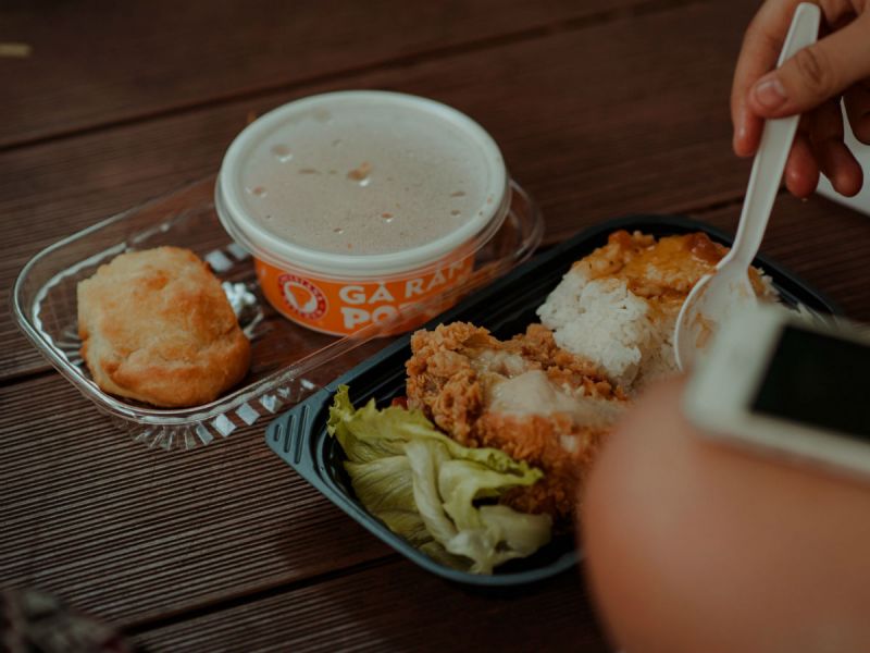 Chicken takeaway in plastic trays.