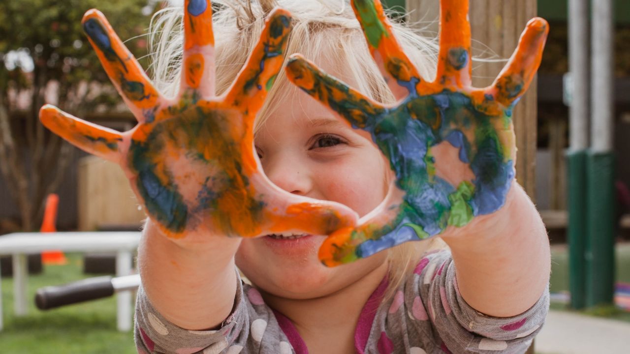Child with paint on hands