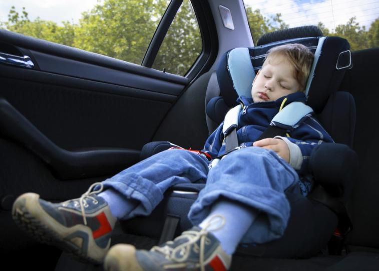 Child asleep in car seat