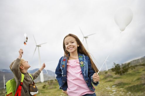 Children in front of wind turbines