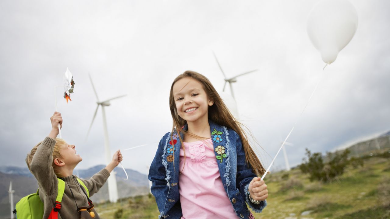Children in front of wind turbines