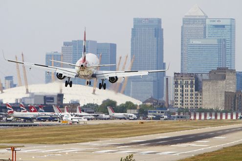 Airplane taking off city airport