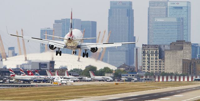 Airplane taking off city airport