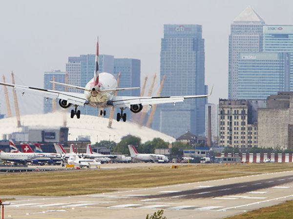 Airplane taking off city airport