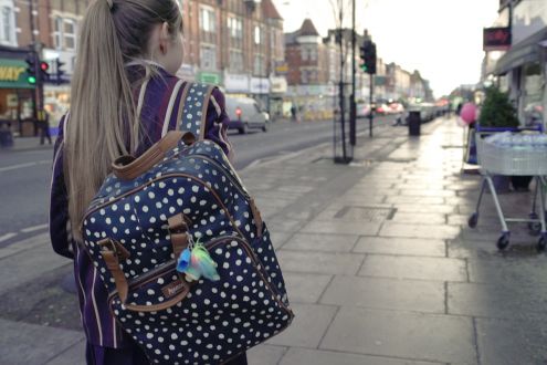 Girl walking down an urban street