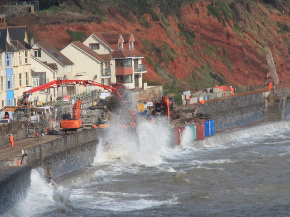Pouring concrete to plug the hole in the sea wall below Sea Lawn Terrace at Dawlish, 24 February 2014.