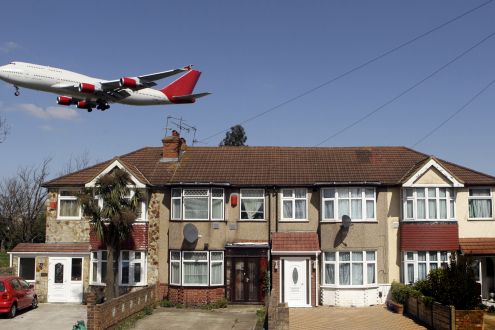 An aeroplane coming into land at Heathrow airport, London, UK