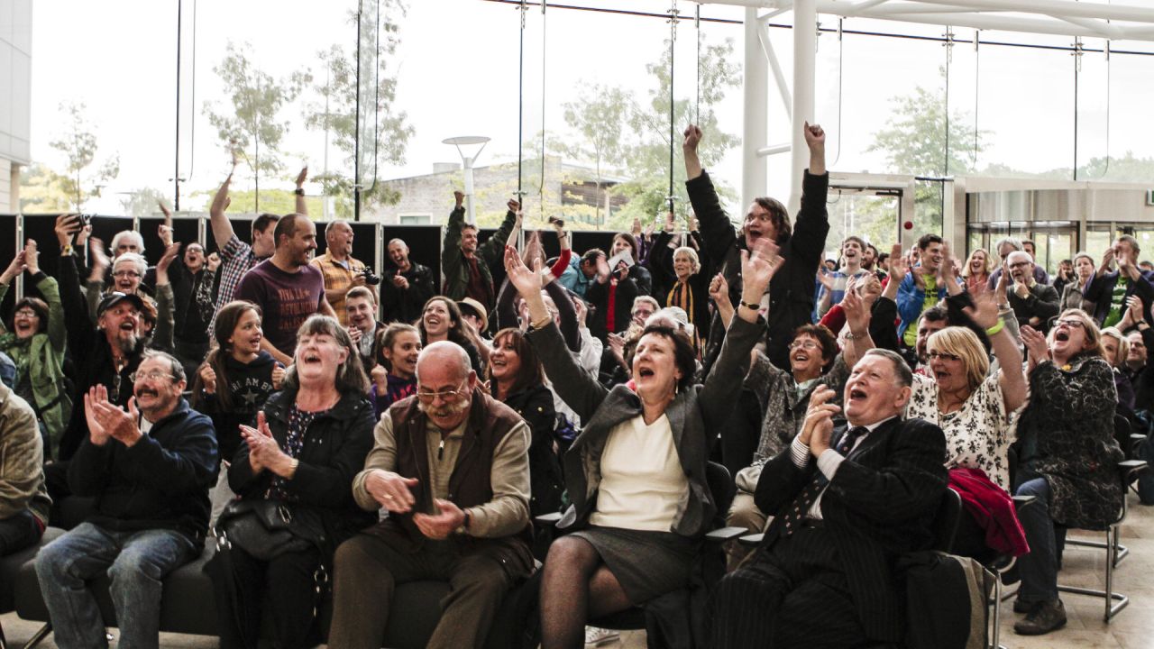 Local communities celebrate the council's unanimous decision to reject an application for a new opencast coal mine, in Nant Llesg, near Merthyr Tydfil in south Wales
