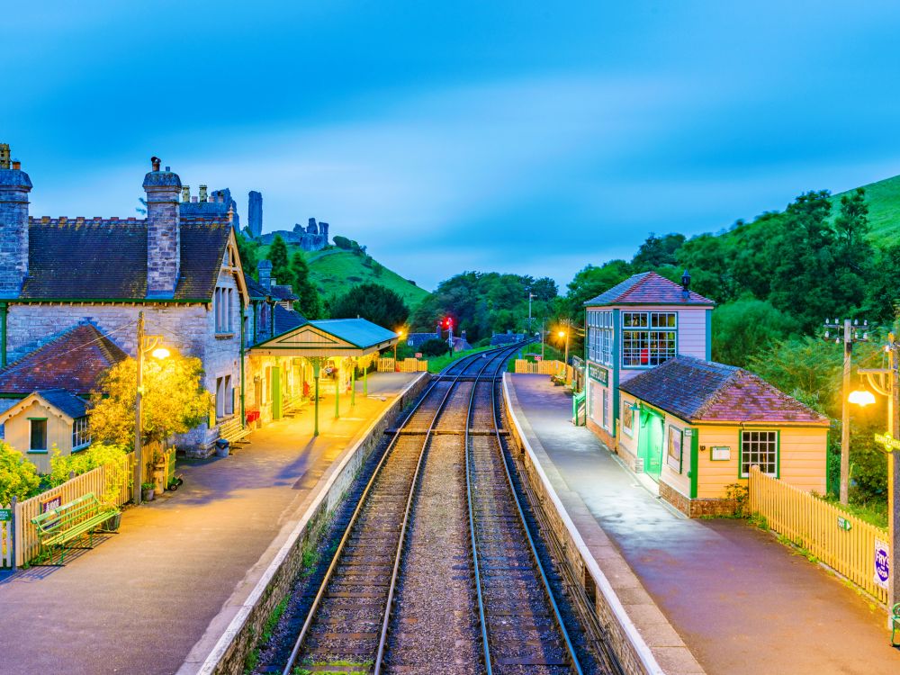 An evening view of Corfe Castle railway station with no one in sight