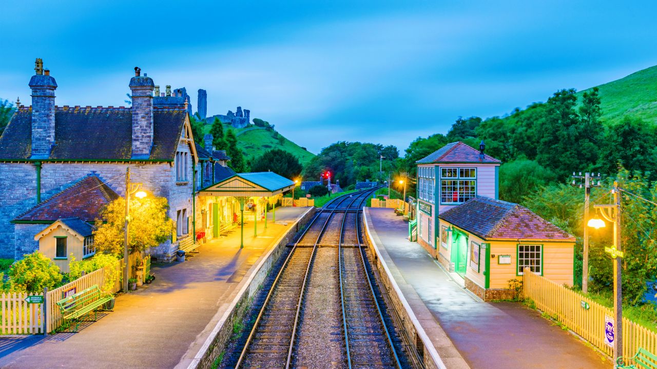 An evening view of Corfe Castle railway station with no one in sight