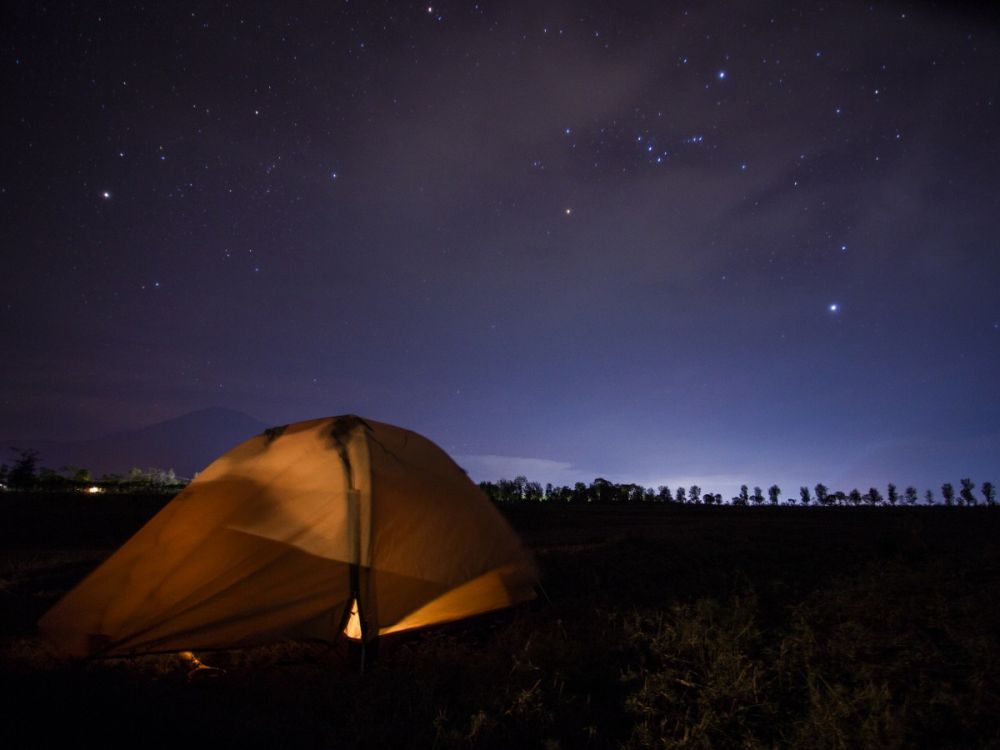Tent in the countryside at night