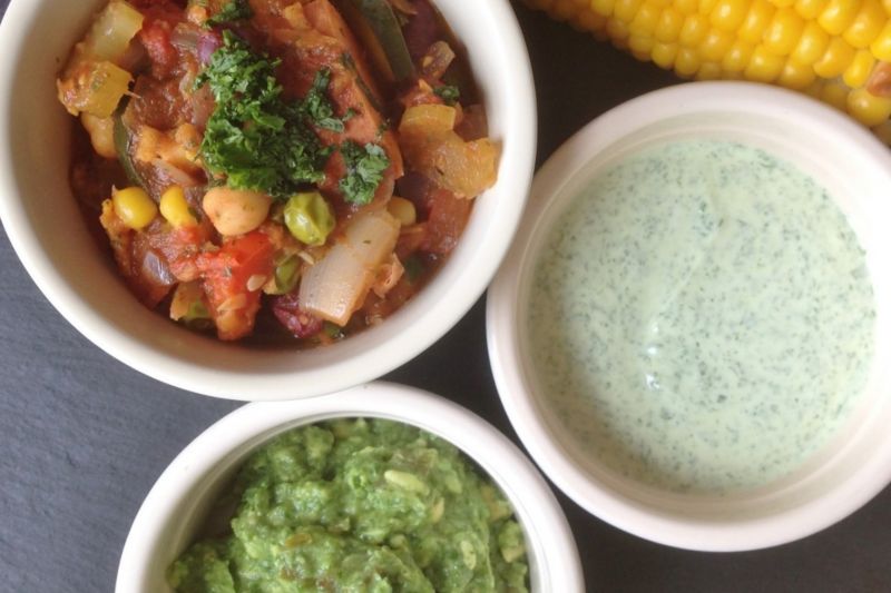 Vegetarian chilli with homemade guacamole, yoghurt and sweetcorn, in pots