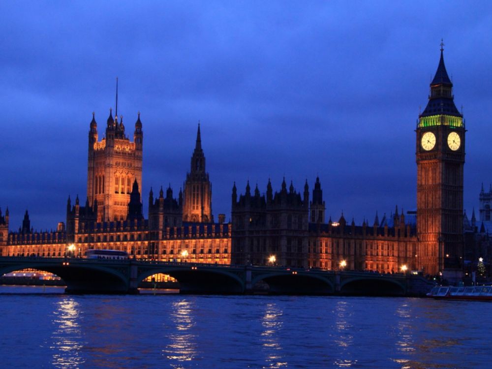 UK parliament at night, over the river Thames
