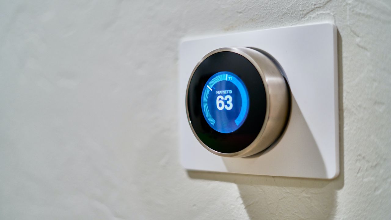 A thermostat showing that the temperature is 63
