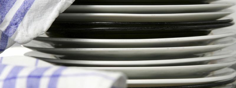 Pile of dishes with cloth