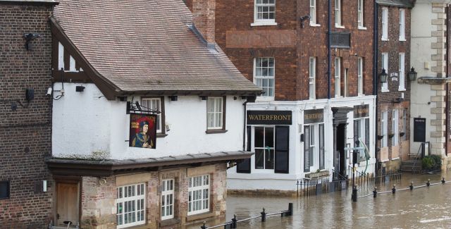 York high street flooded with deep, brown water. No people in the photo.