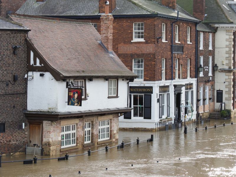 York high street flooded with deep, brown water. No people in the photo.