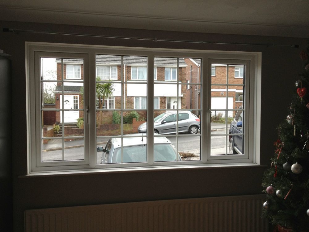 Double-glazed windows looking out from a property on to a residential street