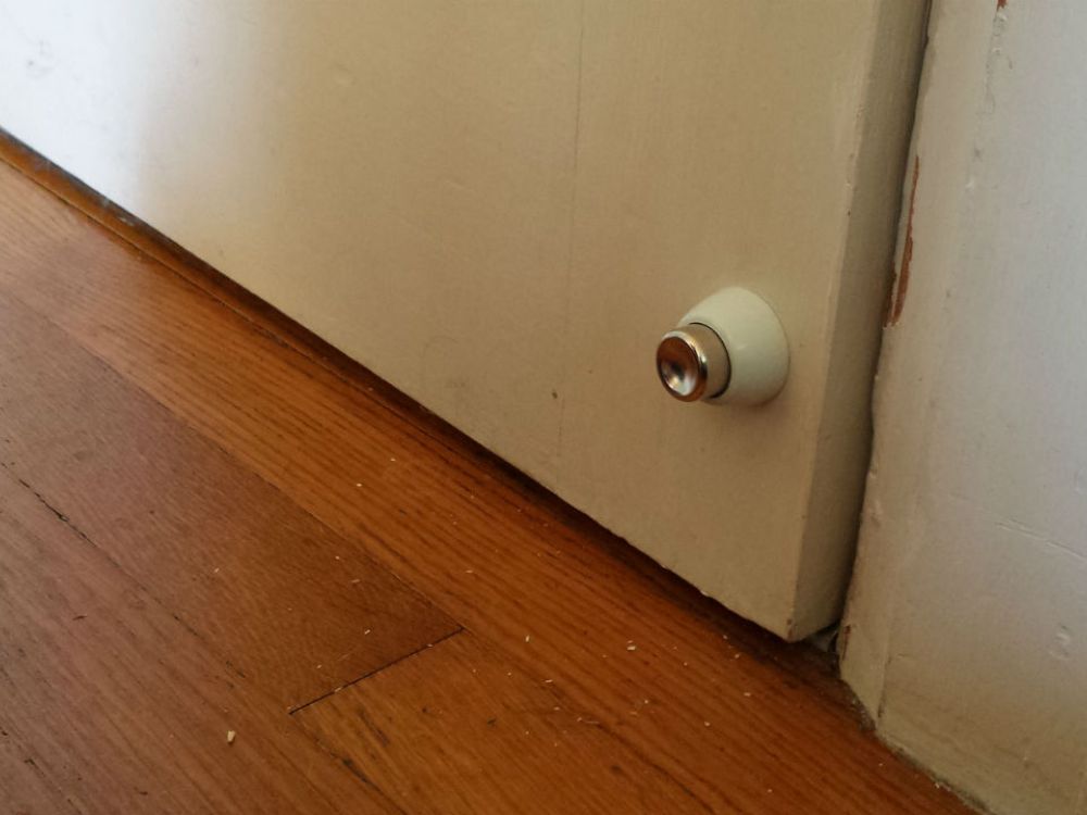 Close up of a door that is letting in the draught