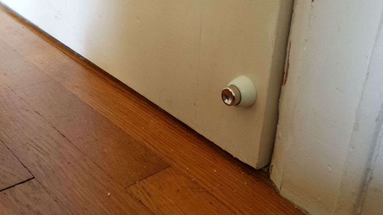 Close up of a door that is letting in the draught