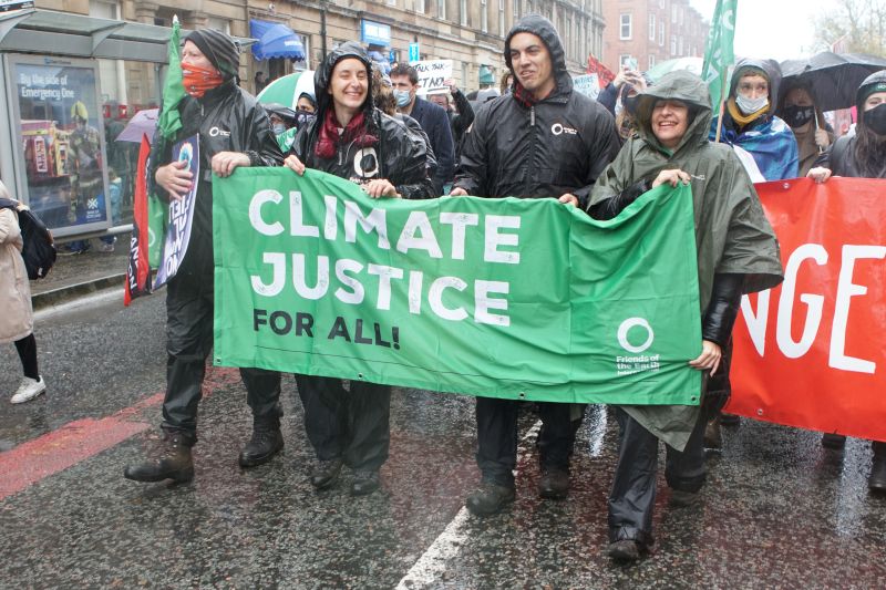 A protest with a banner that read 'Climate justice for all'
