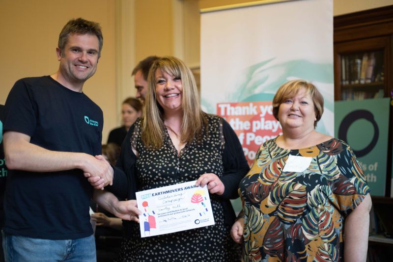 Jos Forester-Melville receives an Earthmovers award from Friends of the Earth CEO Craig Bennett