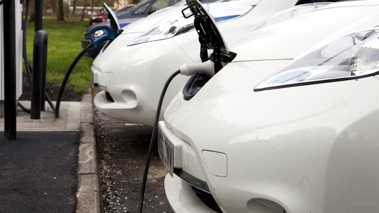 2 electric cars charging from kerbside recharging points.