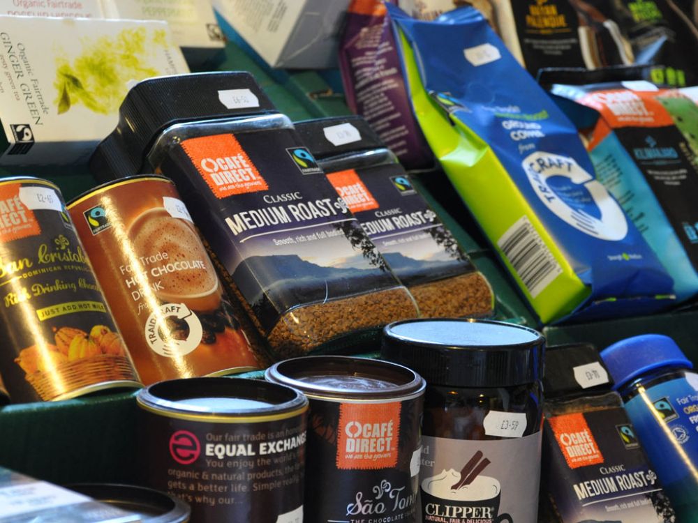 Packs of coffee, tea and cocoa with Fairtrade logo