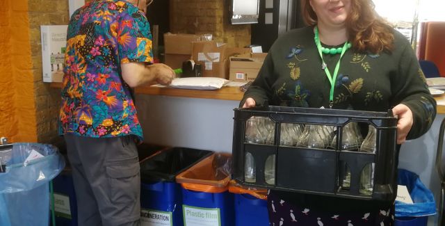 Multiple recycling bins, including glass milk bottle crate, Friends of the Earth London office
