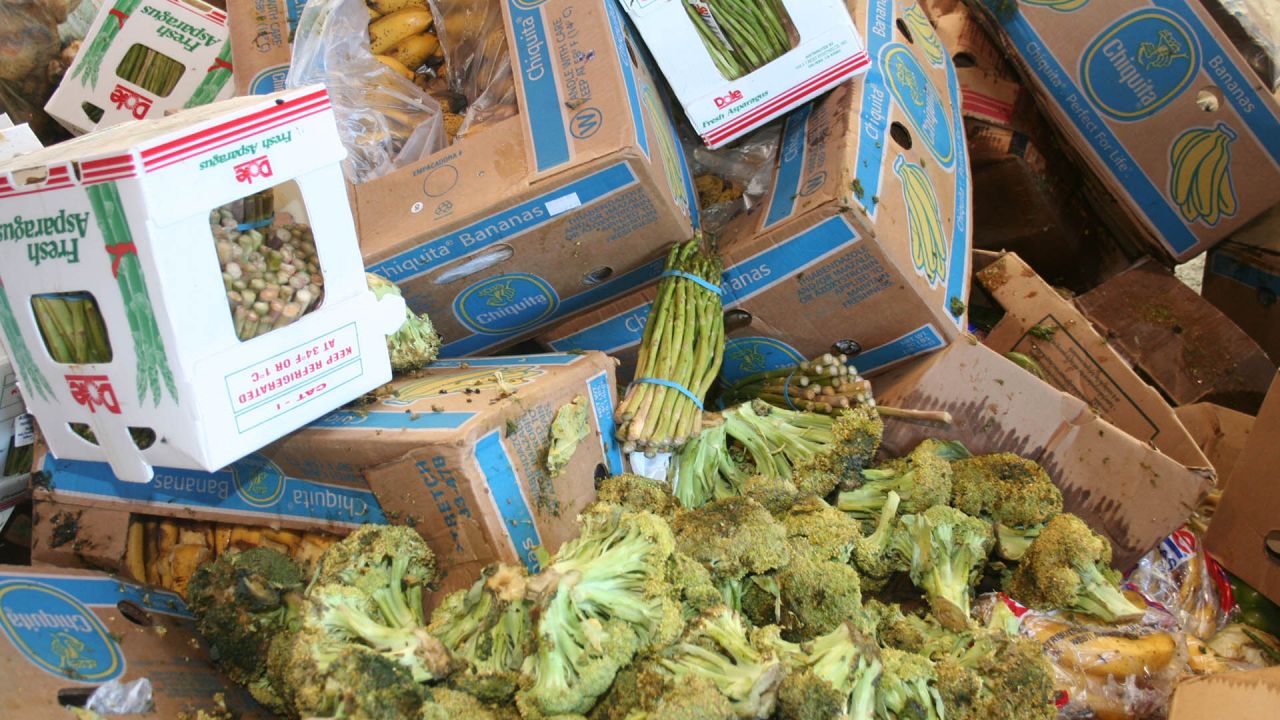 Large mountain of wasted fruit and vegetables at a street market