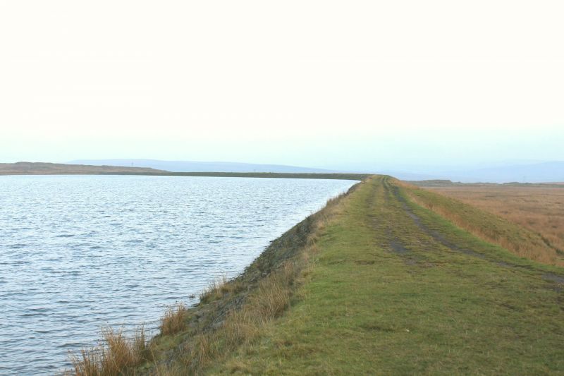 Rhas Las pond near Nant Llesg site. Lake to left, grassland to right.