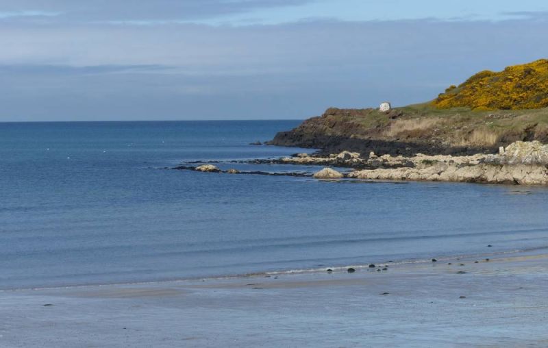 A beach and a rocky headland