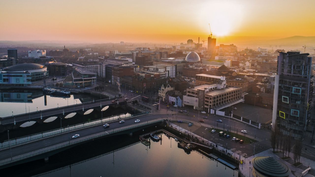 photo of Belfast from the air, with sunset