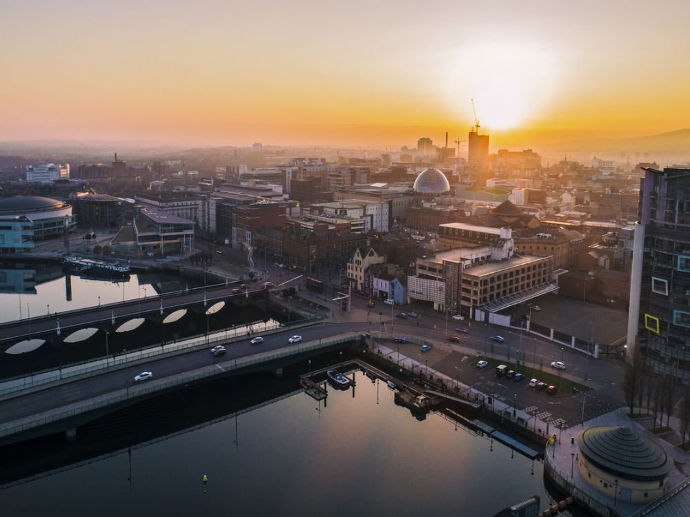 photo of Belfast from the air, with sunset